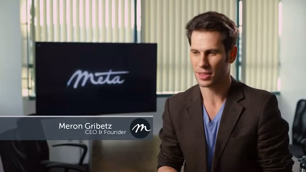 Meta founder Meron Gribetz on camera beside the Meta logo