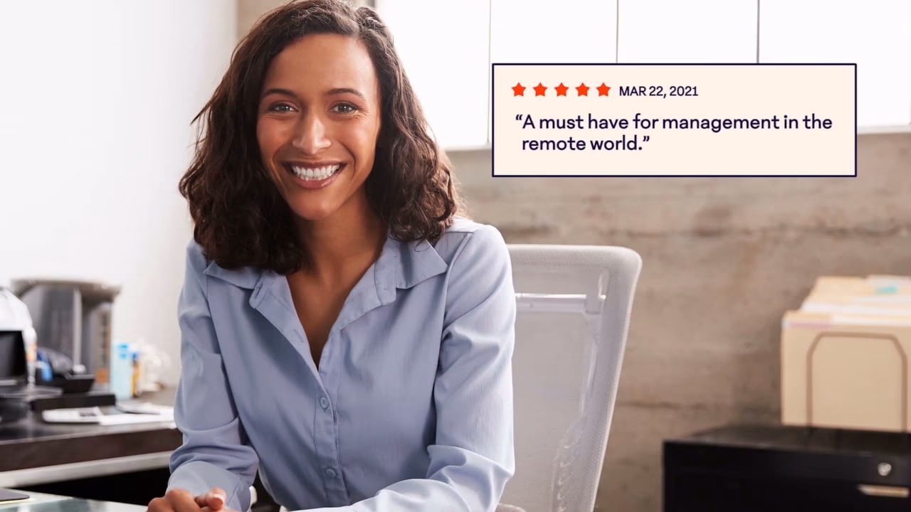 A smiling employee beside a five-star customer review card